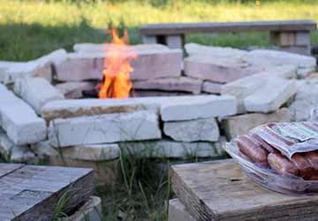 firepit on a grassy field made from white bricks